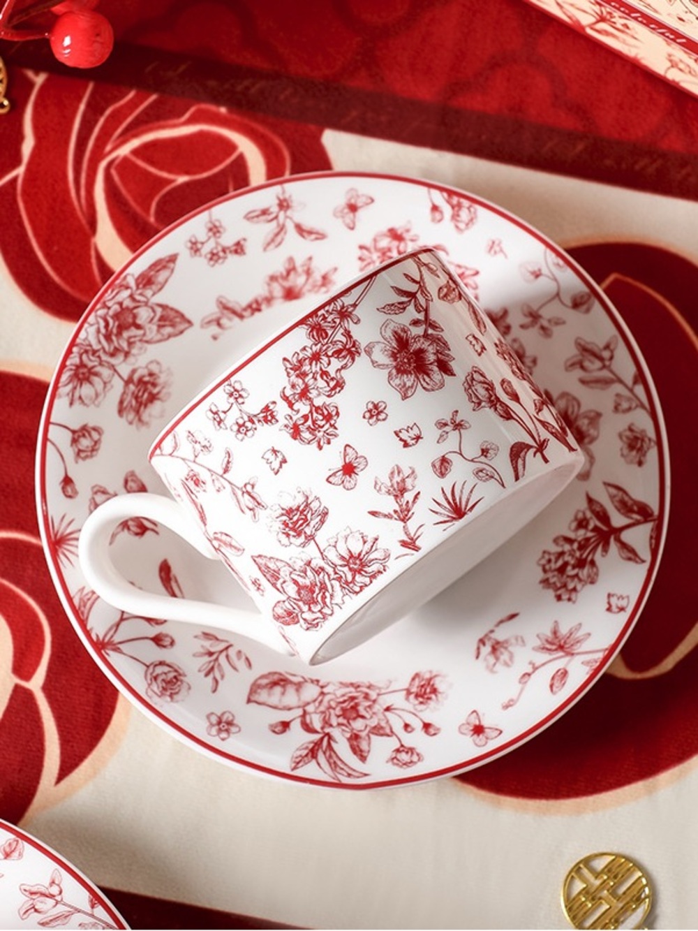White Porcelain Cup & Saucer with Red Floral Design